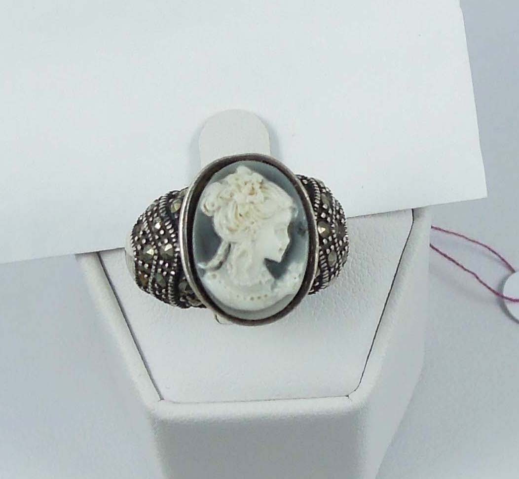 VINTAGE LADIES STERLING MARCASITE AND CAMEO RING: Center cameo of woman and surrounded by marcasite.