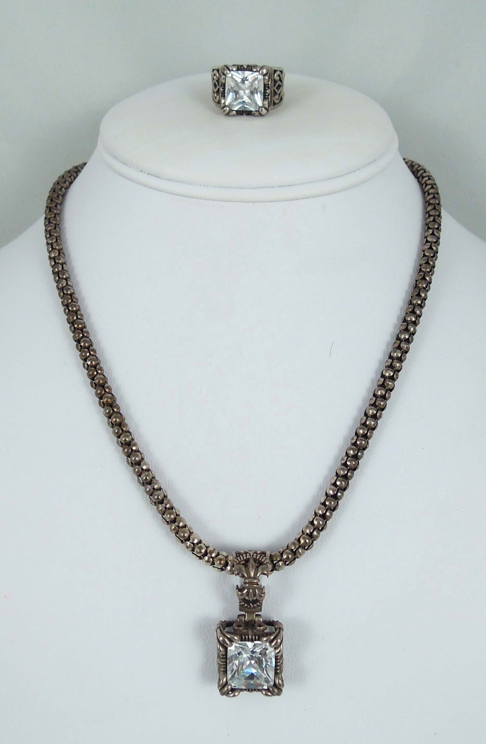 VINTAGE RETIRED DESIGNER SILPADA STERLING SILVER AND CZ NECKLACE AND RING ENSEMBLE: Popcorn necklace with square pendant with large cz. Matching ring.