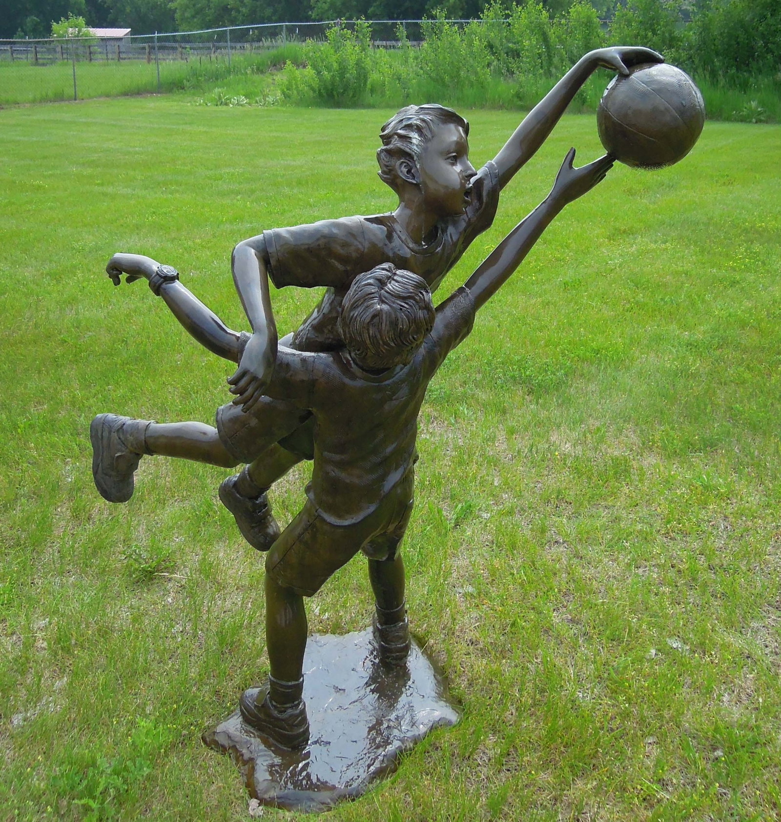 VINTAGE LIFE SIZE BRONZE SCULPTURE OF TO BOYS PLAYING BASKETBALL: Action bronze of boys playing basketball. Great detail. Very heavy. Brown patina. 55" high, 4' wide, 30" deep.