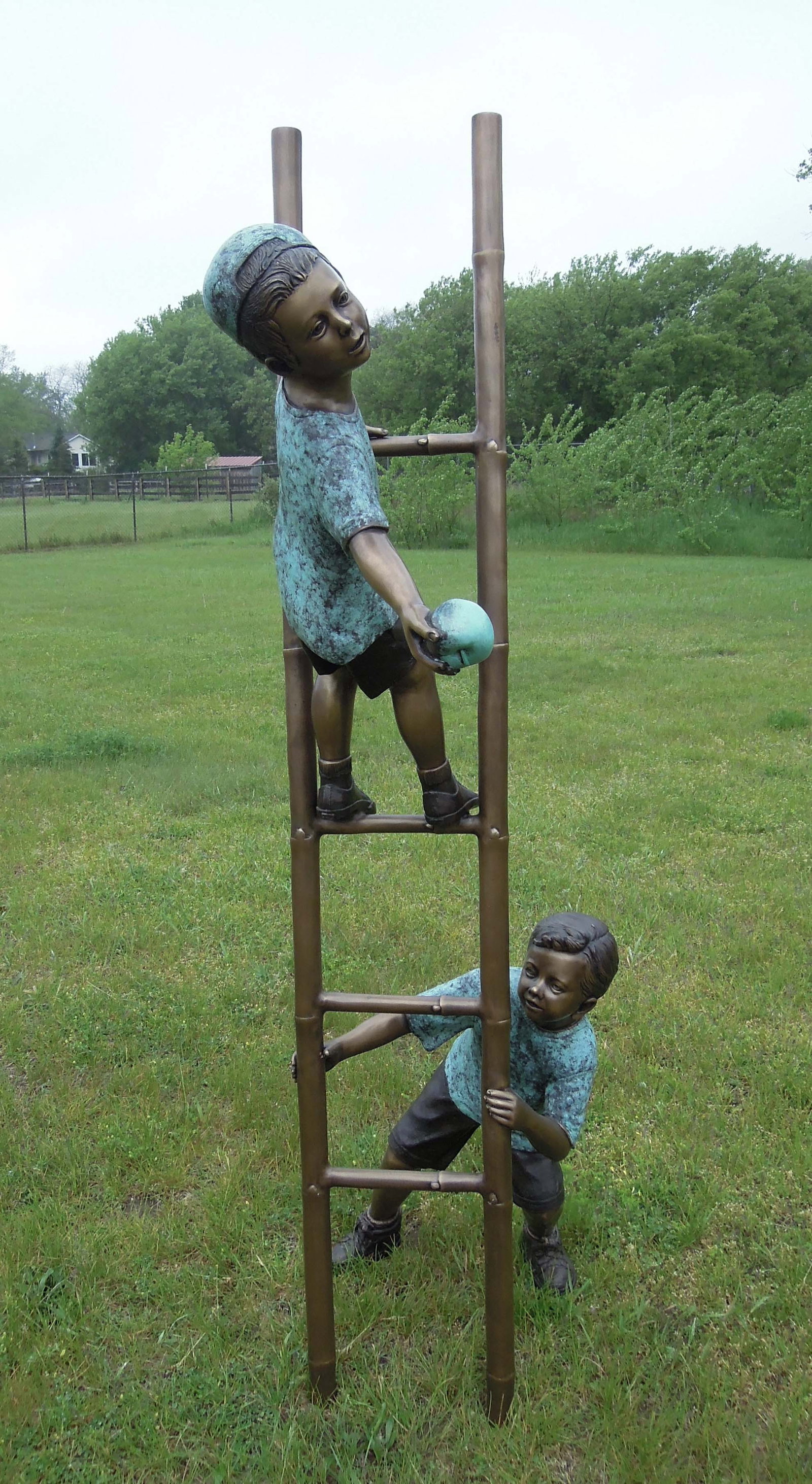 HEAVY LIFE SIZE BRONZE SCULPTURE OF TWO CHILDREN ON LADDER: One boy holds base of ladder as other boy climbs ladder. Three color patina. Excellent detail. 79" high, 20" wide, 34" deep.
