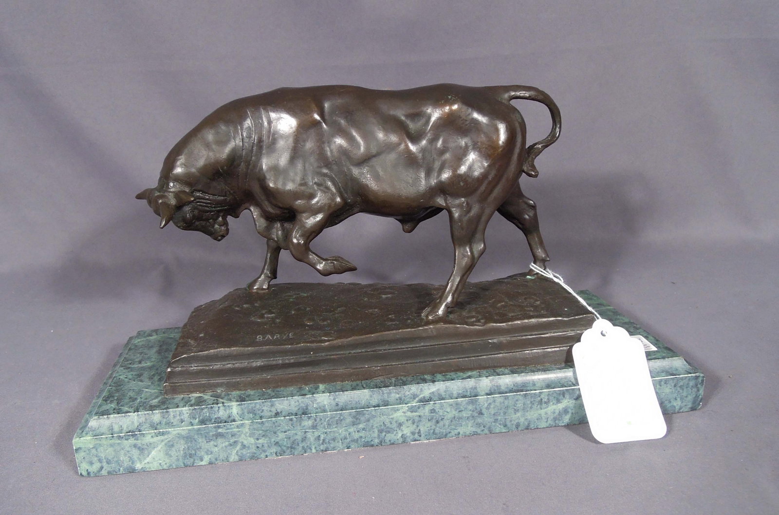 VINTAGE BRONZE SCULPTURE OF CHARGING BULL AFTER BARYE: Green marble bade. 8" high, 14 1/4" long, 5 1/2" deep.