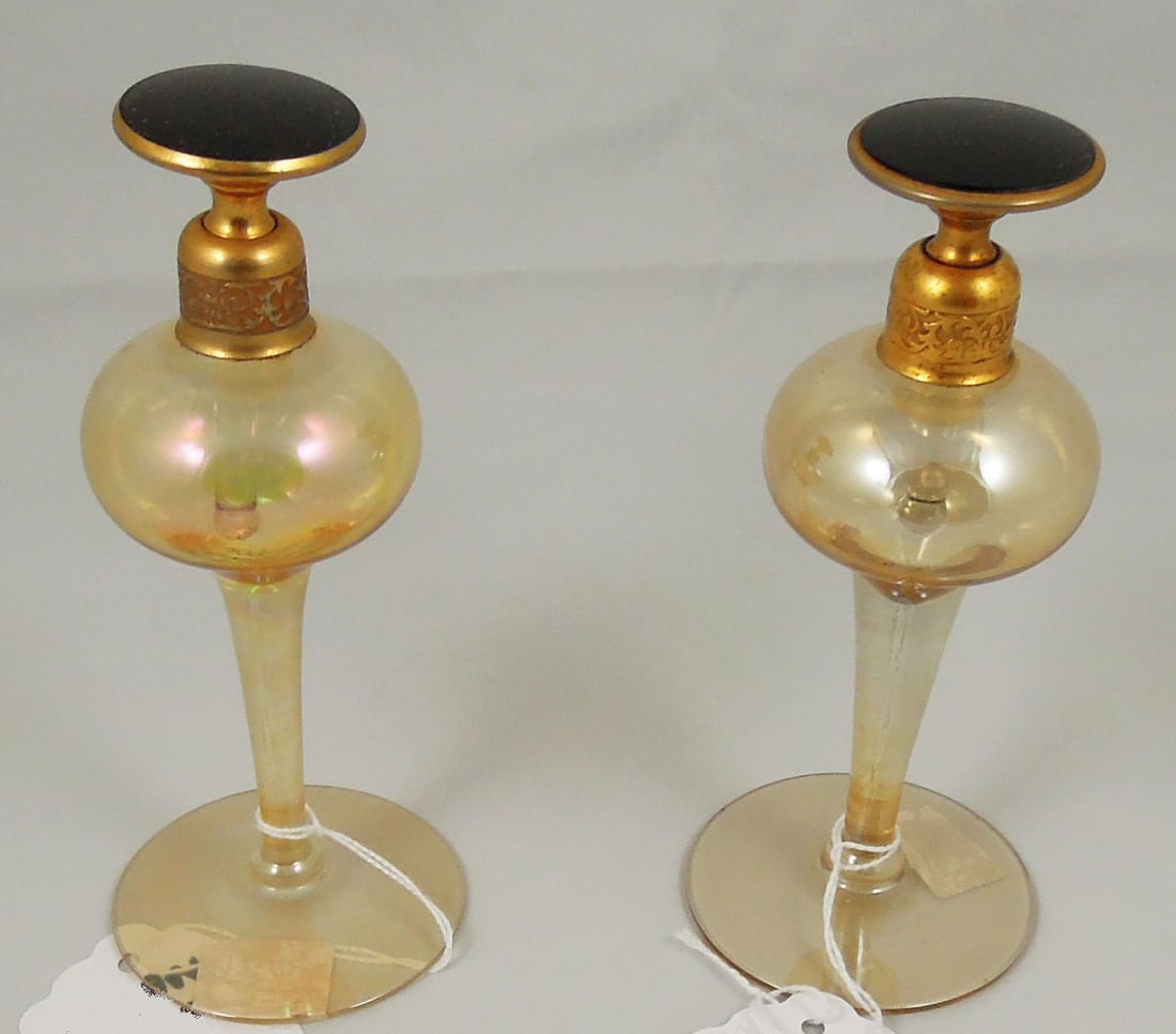 TWO UNSIGNED VINTAGE DEVILBISS PERFUME BOTTLES: Amber coloration. Good condition. Each 5 1/2" high.