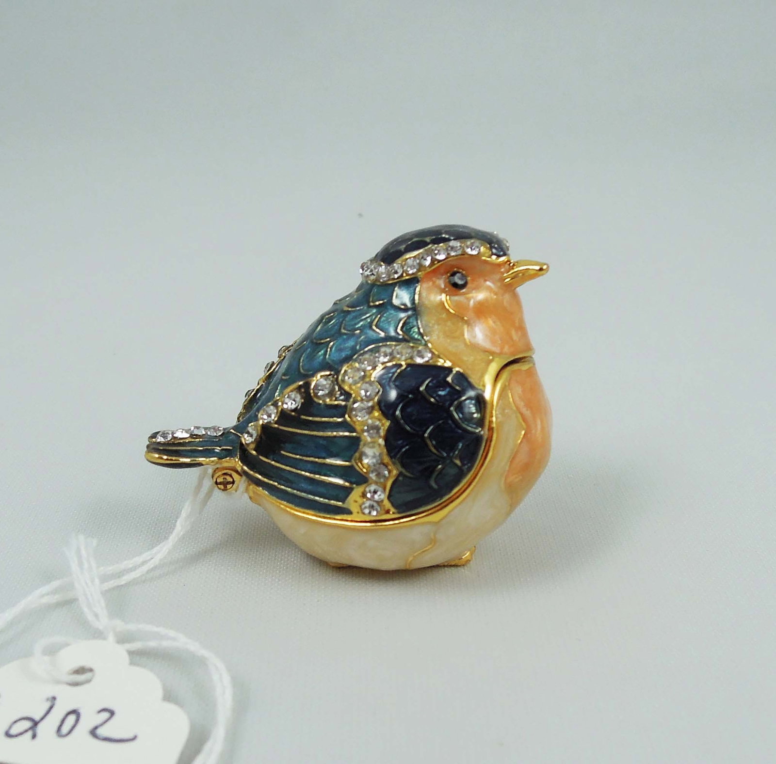 METAL, ENAMEL & RHINESTONE BIRD TRINKET BOX: 1 3/4" high, 1 1/2" wide, 2" deep.