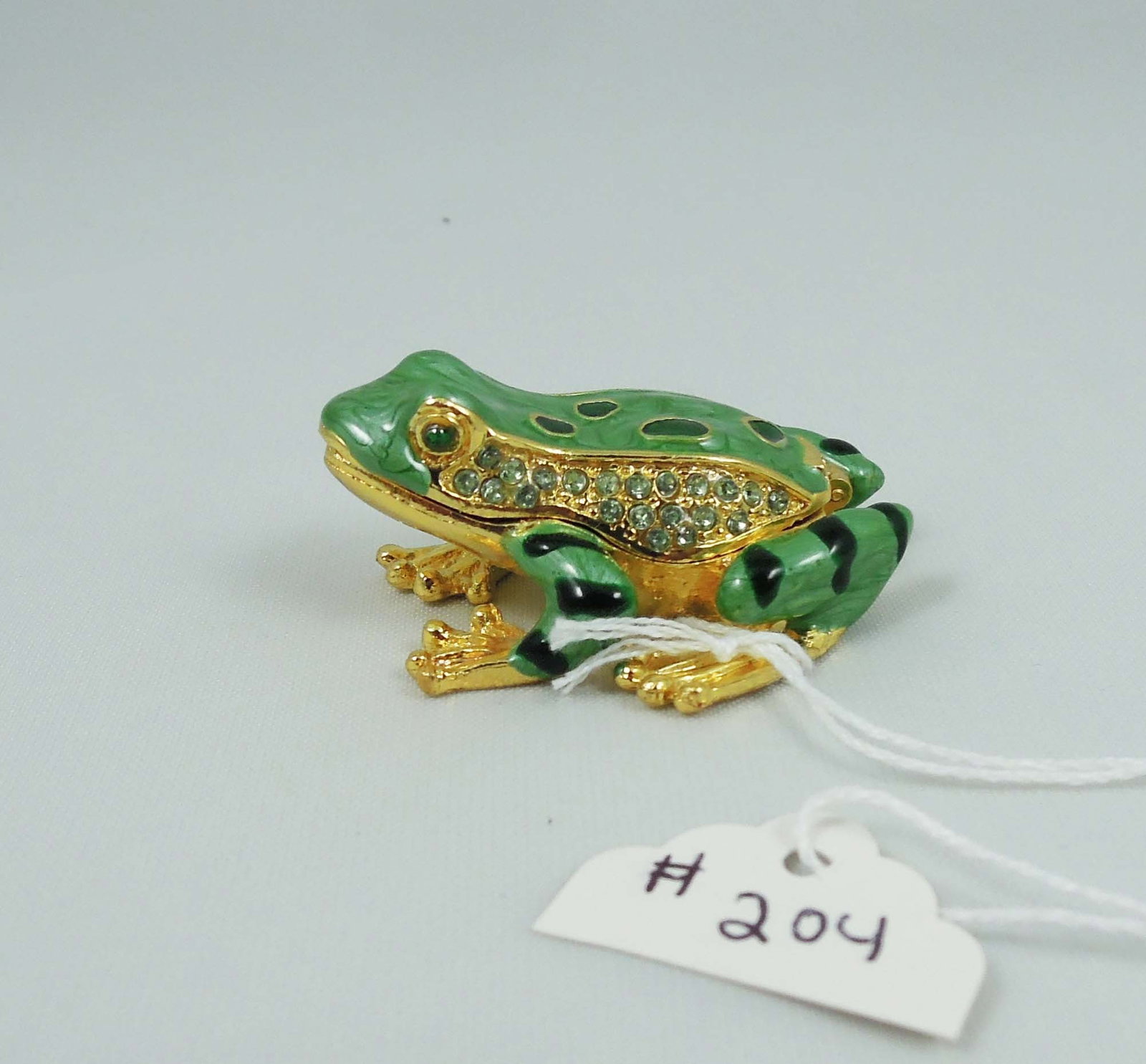 METAL, ENAMEL & RHINESTONE FROG TRINKET BOX: 1" high, 2" long, 1 3/4" wide.