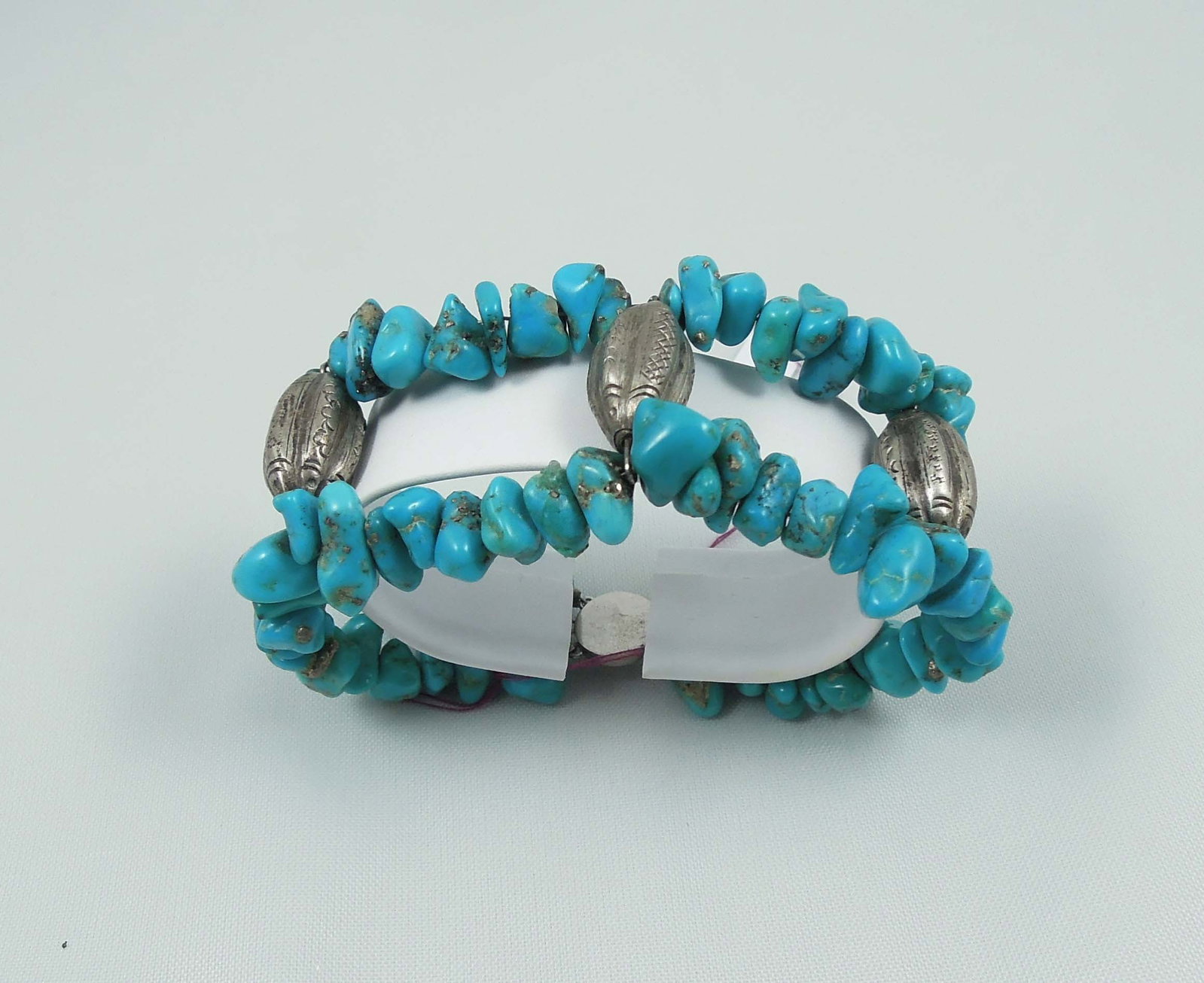 VINTAGE NATIVE AMERICAN STERLING SILVER & TURQUOISE BEAD BRACELET: Bracelet with two rows of beaded turquoise separated with three large sterling silver dividers. 7 3/4" long.