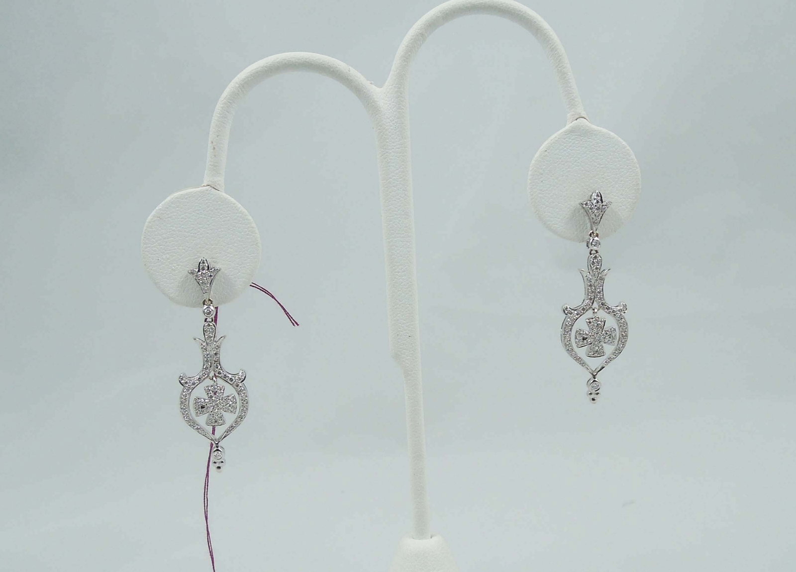 PAIR LADIES FINE 14K W.G. & DIAMOND DANGLE EARRINGS: Dangle with ornate drop with a center diamond set cross. Total diamond weight approx. .75 ct
