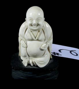 HAND CARVED CHINESE IVORY SEATED BUDDHA: HAND CARVED CHINESE IVORY SEATED BUDDHA Fitted stand. 3" high, overall 4" high