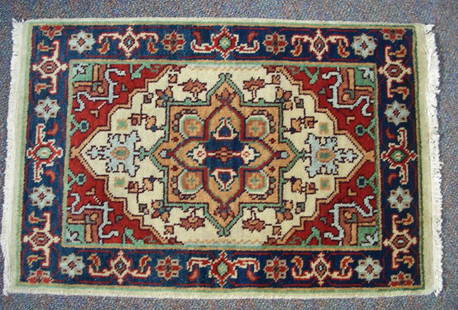 SERAPI AREA RUG: SERAPI AREA RUG Blue, green and rust coloration. 2 x 3