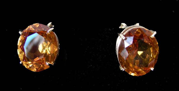 PAIR LADIES 14K YELLOW GOLD AND CITRINE EARRINGS: PAIR LADIES 14K YELLOW GOLD AND CITRINE EARRINGS A yellow gold earring supports an oval heavily faceted citrine. Total citrine weight approx. 8 cts.