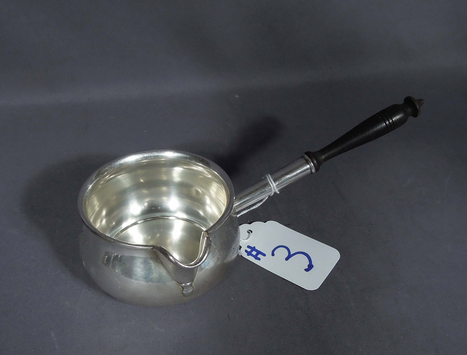 ANTIQUE FRANK M. WHITING & COMPANY STERLING SILVER BRANDY WARMER/SAUCE BOAT: Very good condition. Monogramed "H". Serial number 1609. Wooden handle. Weighs 188 grams. 3 1/4" high, 9" long, 4 1/4" dia.