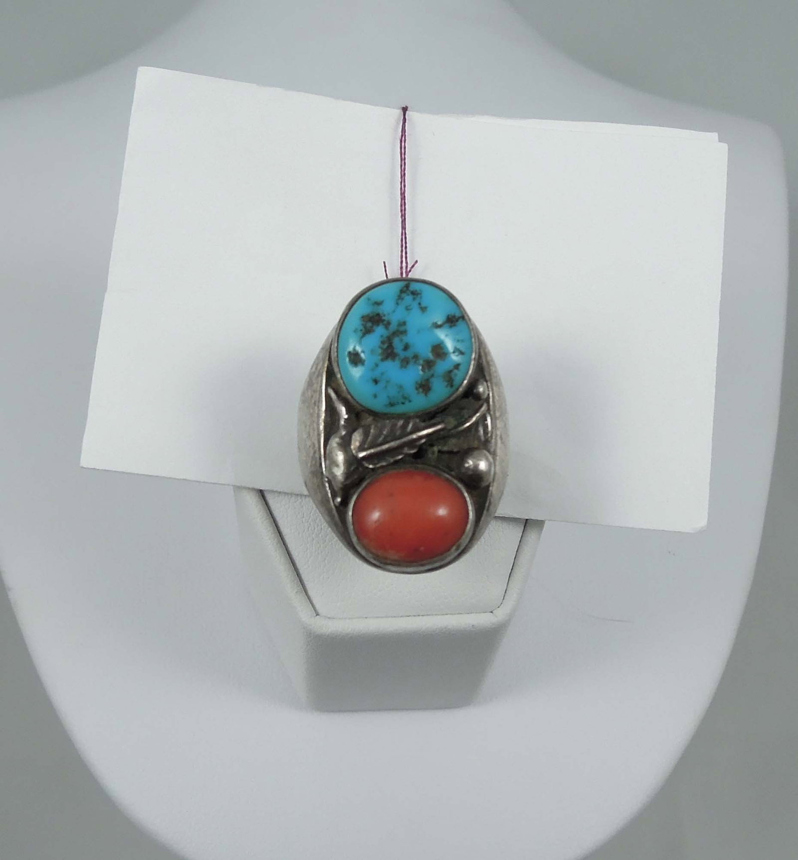 HEAVY VINTAGE NATIVE AMERICAN STERLING SILVER & TURQUOISE RING: Coral and turquoise separated by a sterling silver feather. 19.2 grams.