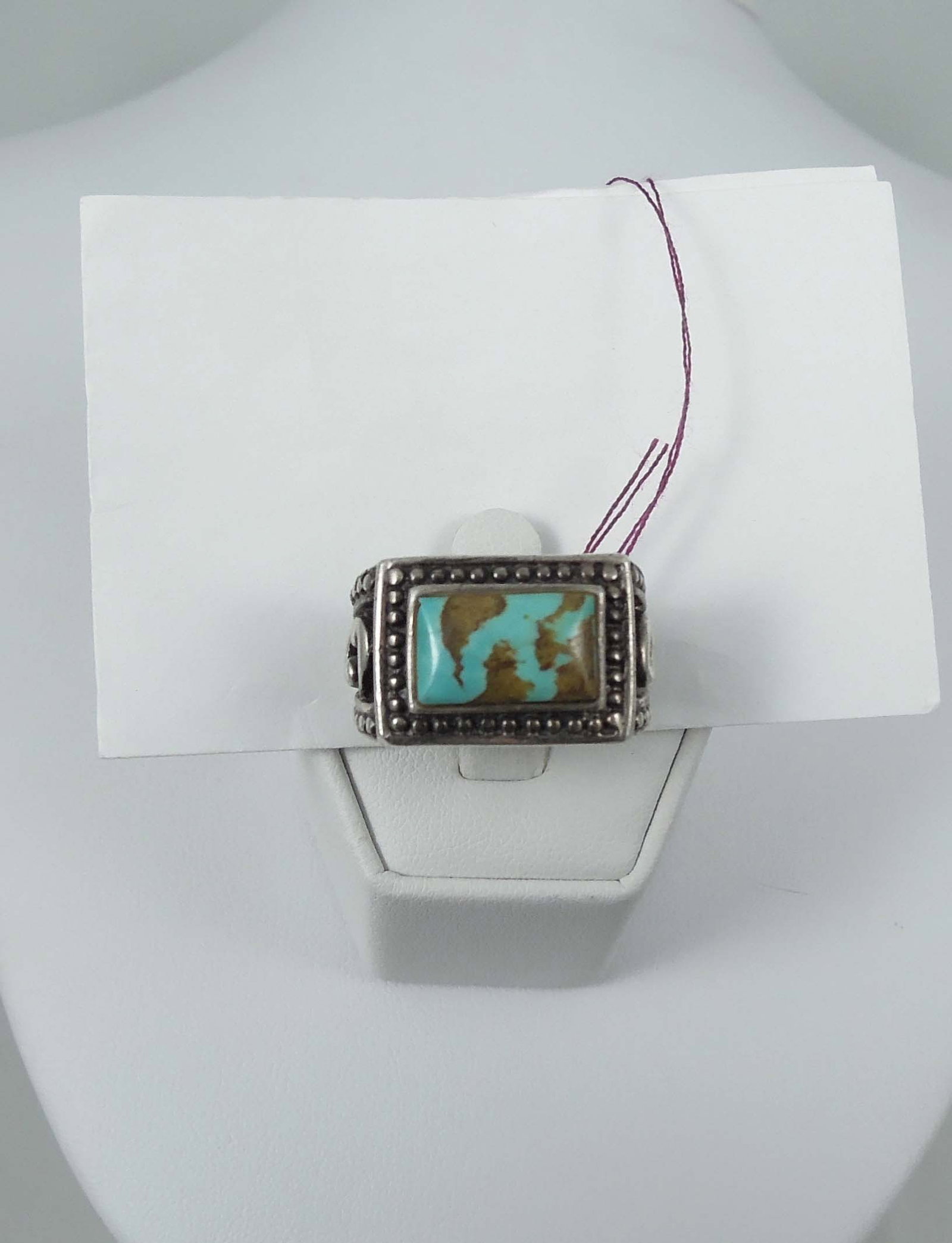 SIGNED BARSE STERLING SILVER & TURQUOISE RING: A heavy sterling ring with open work mount set with a rectangular gold and blue turquoise. Signed inside ring. 17.1 grams.