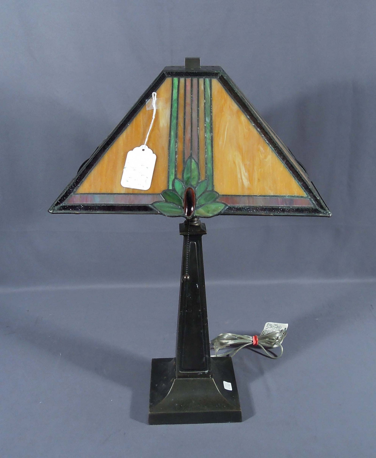 BEAUTIFUL METAL AND SLAG GLASS TABLE LAMP: An Arts & Crafts style metal base supports a slag glass and leaded glass shade. 25 1/2" high, 16" sq.