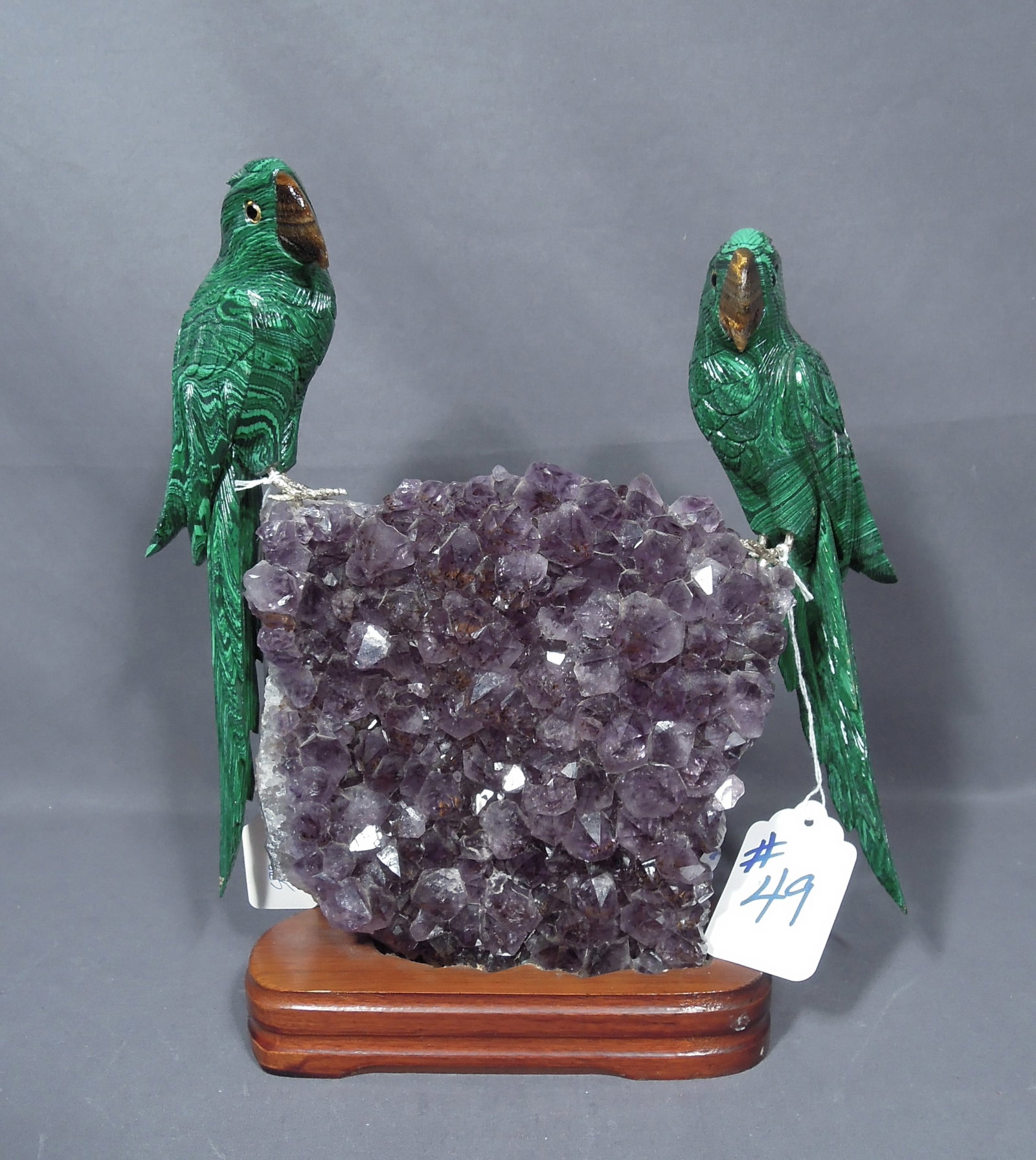 VERY UNUSUAL HAND MADE AND CARVED AMETHYST & MALACHITE SCULPTURE: A beautiful amethyst base with two perched hand carved malachite birds. Fitted stand. Excellent condition. 13" high, 11 1/2" wide, 3 1/2" deep.