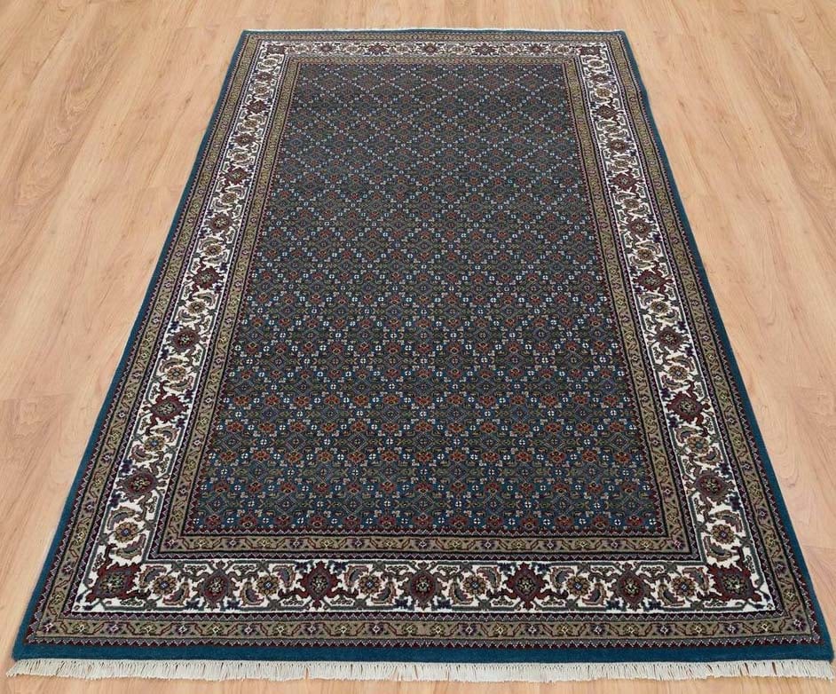 FINE HAND KNOTTED MAHI TABRIZ AREA RUG: 100% wool. Aegean blue ground. Excellent condition. 5' x 8'1".