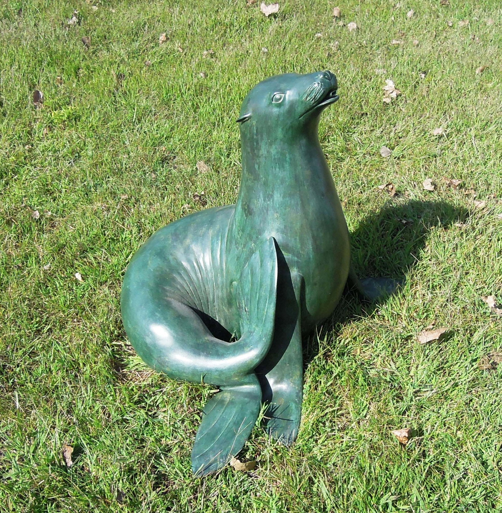 LIFE SIZE BRONZE SCULPTURE/FOUNTAIN OF SEAL: Nice aged patina. Water emerges from seal's mouth when used as a fountain. 28" high.