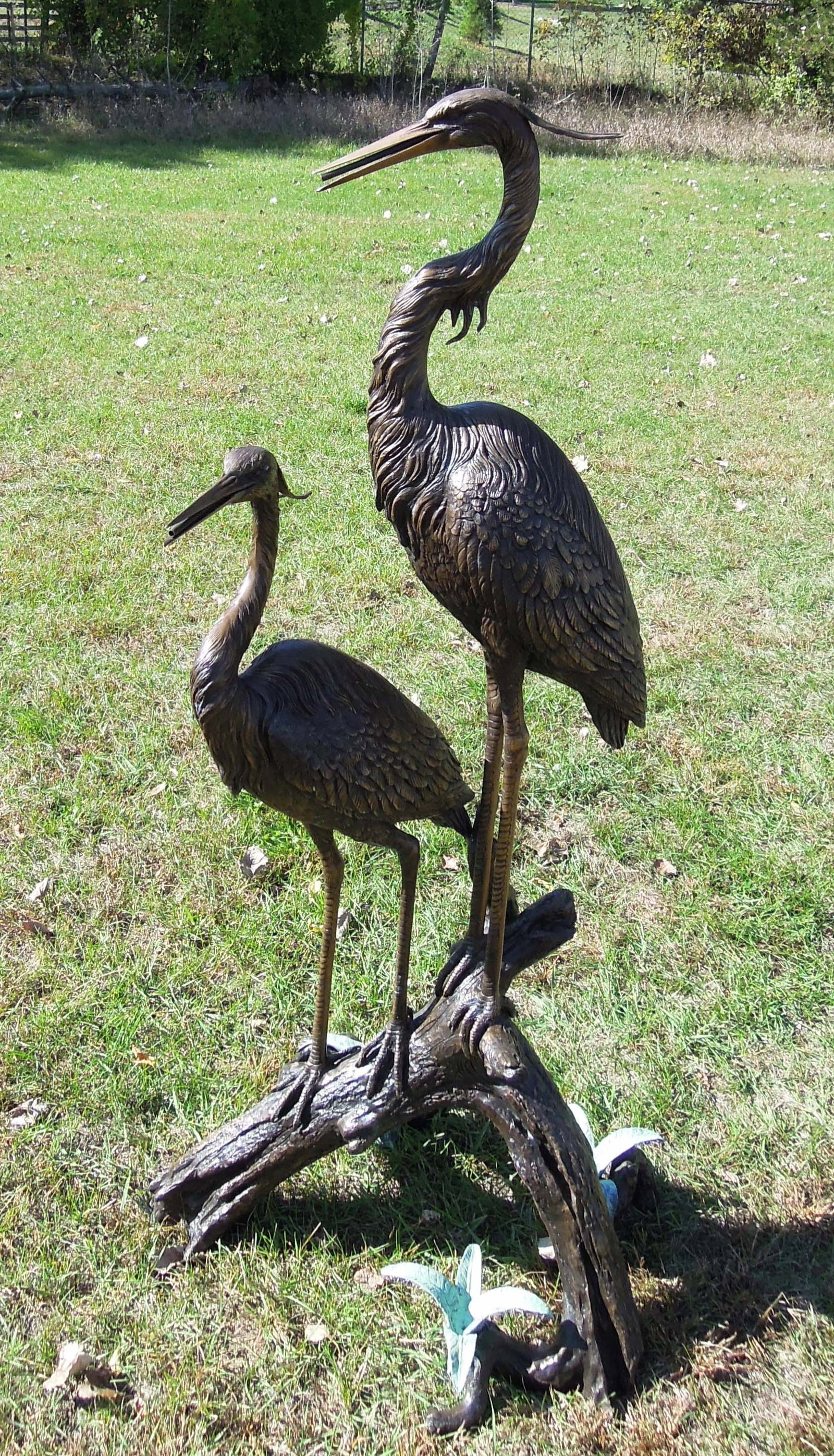 OUTSTANDING LARGE BRONZE SCULPTURE/FOUNTAIN OF DOUBLE HERONS ON BRANCH: Very fine detail. Herons stand on a branch. Water emerges from each heron's mouth and flowers on base when used as a fountain. 69" high, 31" wide, 23" deep.