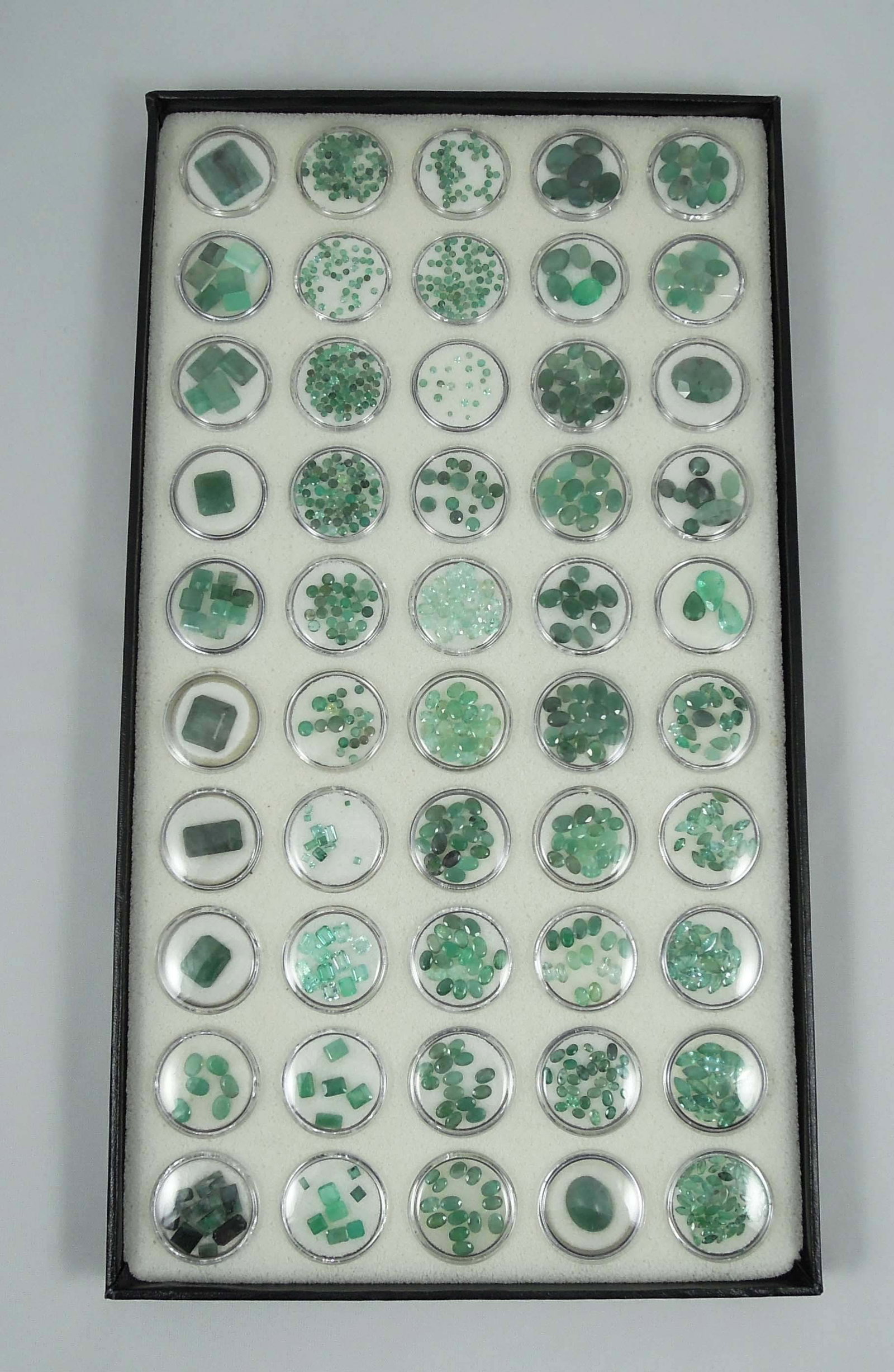 CASED BOX OF NATURAL LOOSE EMERALDS: 100's of cts.