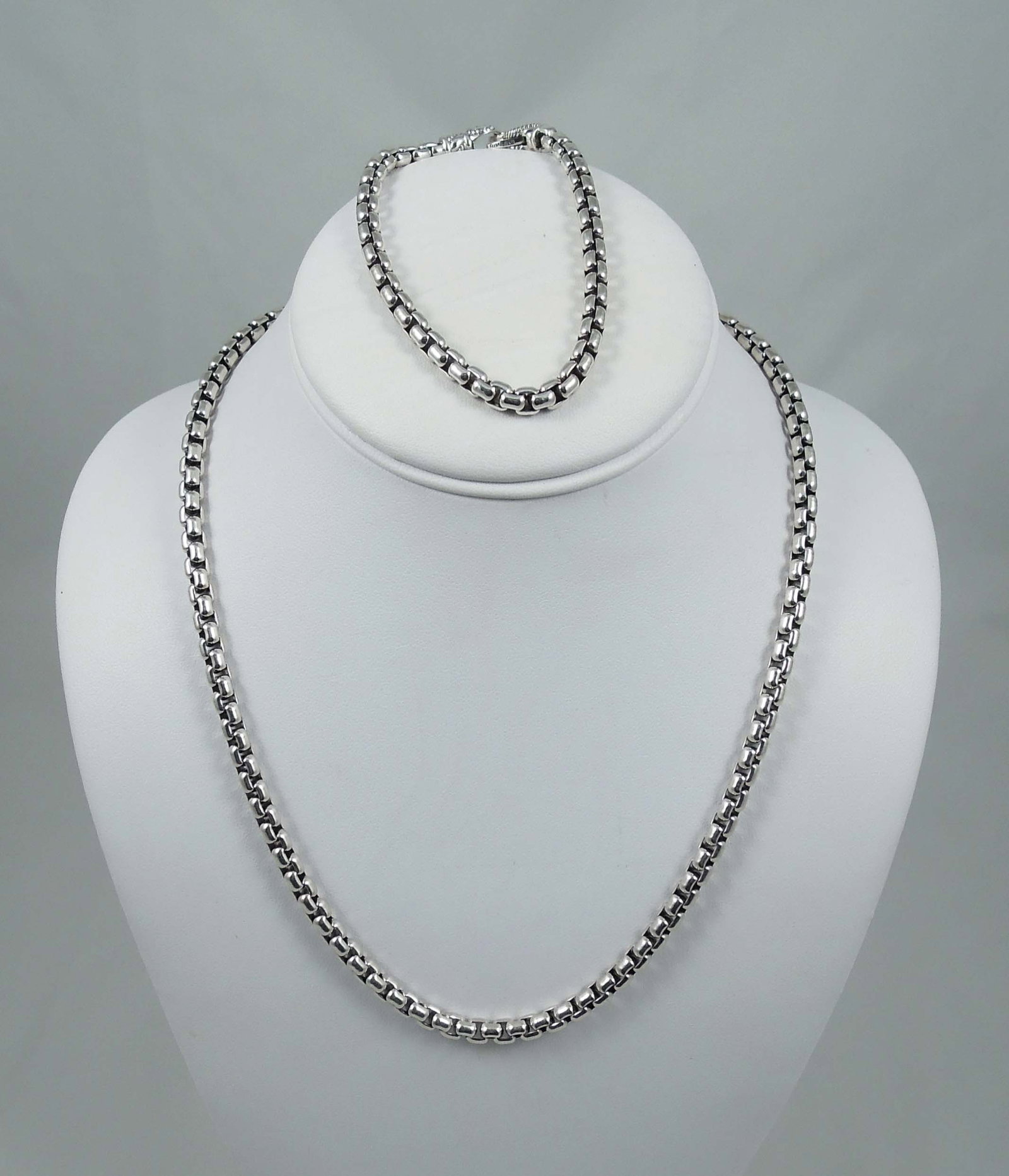 DESIGNER JAI (BY JOHN HARDY) HEAVY STERLING SILVER NECKLACE & BRACELET ENSEMBLE: Each with box chain design. Necklace 19 3/4" long, bracelet 8" long. Bothe pieces signed. Total weight 85.9 grams.