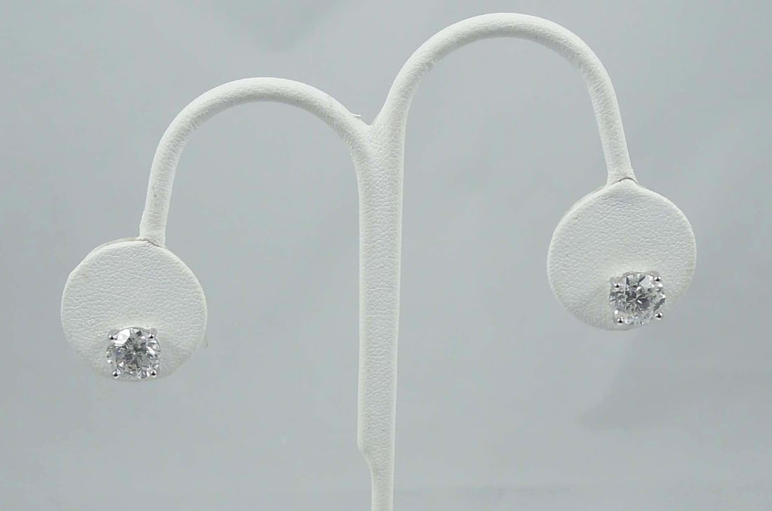 PAIR LADIES BEAUTIFUL 14K W.G. & DIAMOND STUD EARRINGS: A four prong white gold mount each set with a fine full cut round diamond. Total diamond weight 4.15 cts. Complete with GGA appraisal. I1-I2 clarity, G-H color. Note: These dimaonds face up beautifull