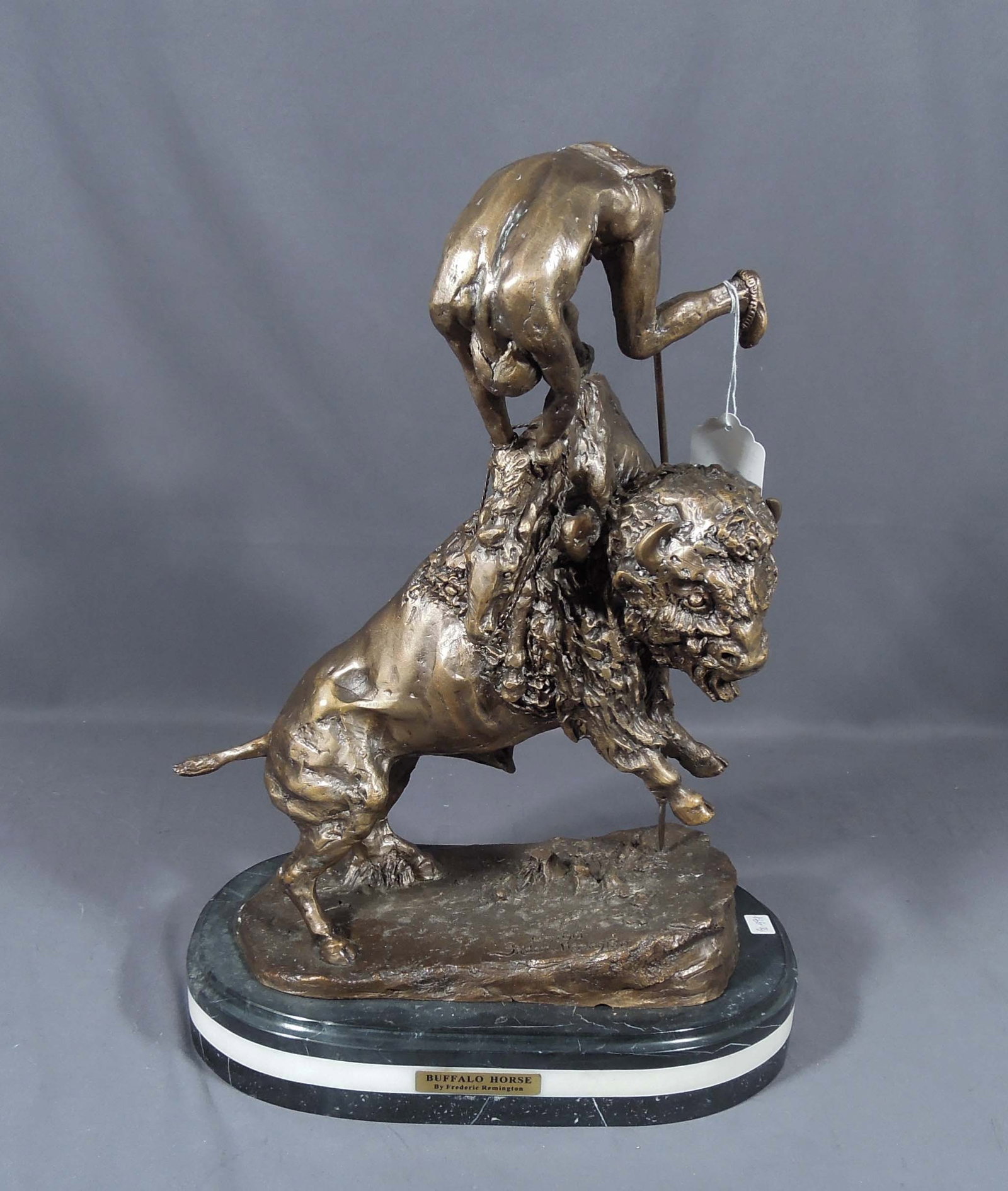 BRONZE SCULPTURE "BUFFALO HUNT" AFTER FREDERIC REMINGTON: Excellent detail. Brown patina. Marble base. 21" high, 15" wide, 9" deep.