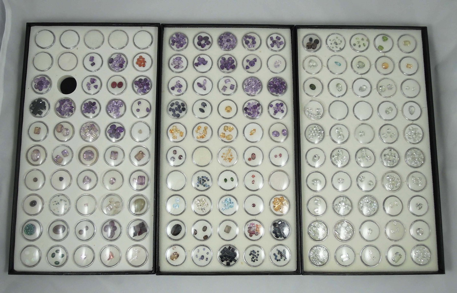 3 CASED BOXES OF NATURAL GEMSTONES: Including green amethyst, citrine, topaz, spesserite garnet, opal, ametrine and more.