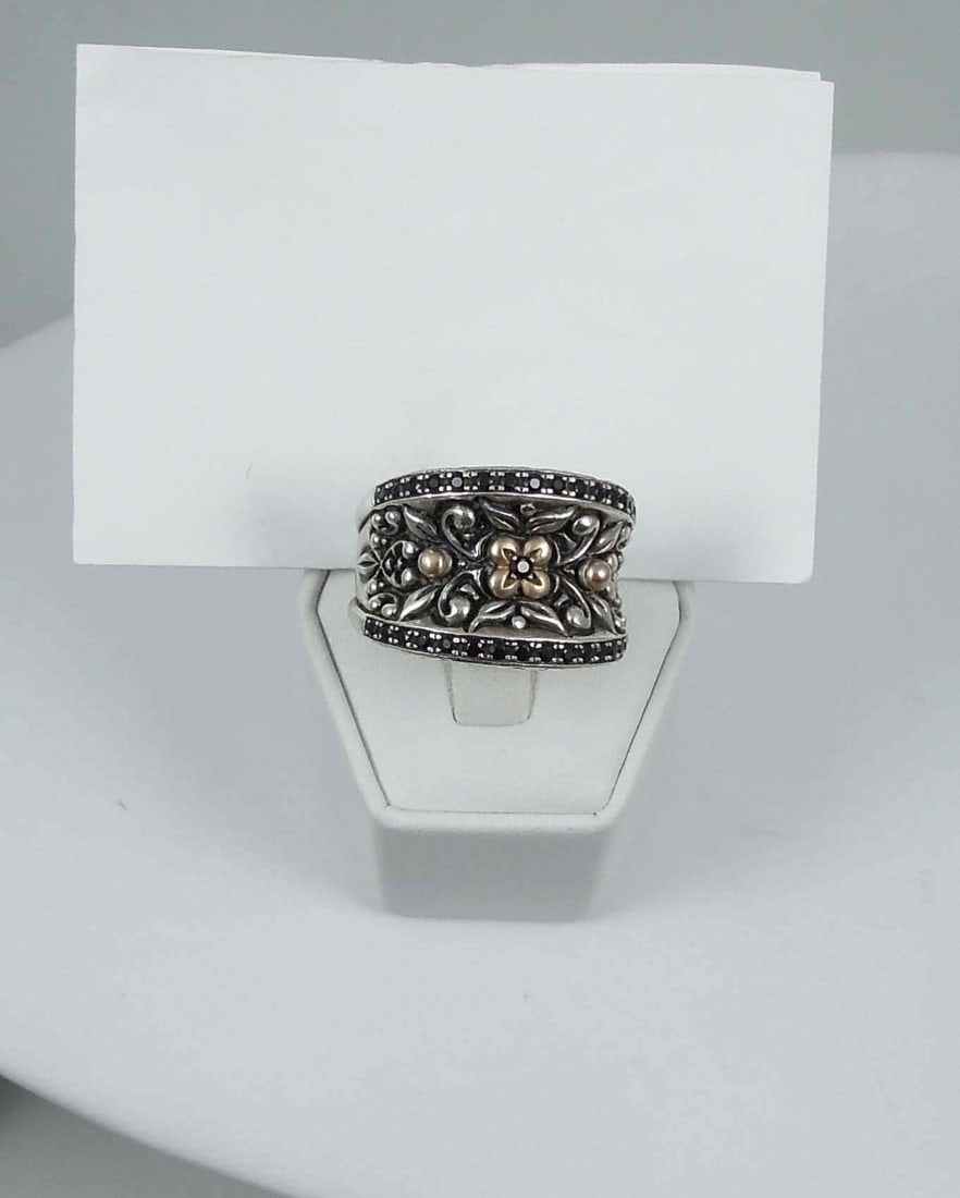 DESIGNER BARBARA BIXBY 18K Y.G., STERLING SILVER & BLACK SAPPHIRE RING: A wide band with two rows of black sapphires. Signed Bixby 925 18K. Ring weighs 17.5 grams.