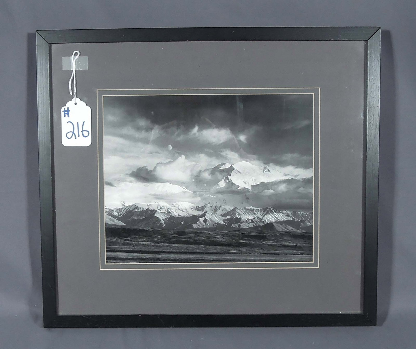 ANSEL ADAMS FRAMED PRINT "MOON & MT. MCKINLEY: Featured in a black frame and mated border. 17" x 19 1/2" x 1 1/4".
