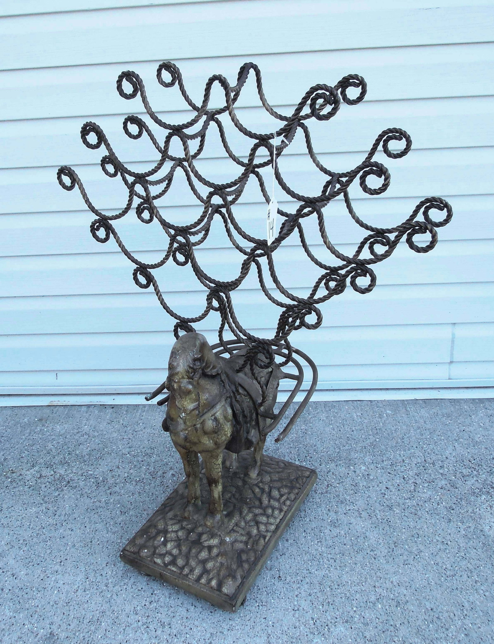 UNUSUAL COMPOSITION & METAL HORSE MOTIF WINE RACK: Holds approx. a case of wine. 35" high, 26" wide, 15" deep.
