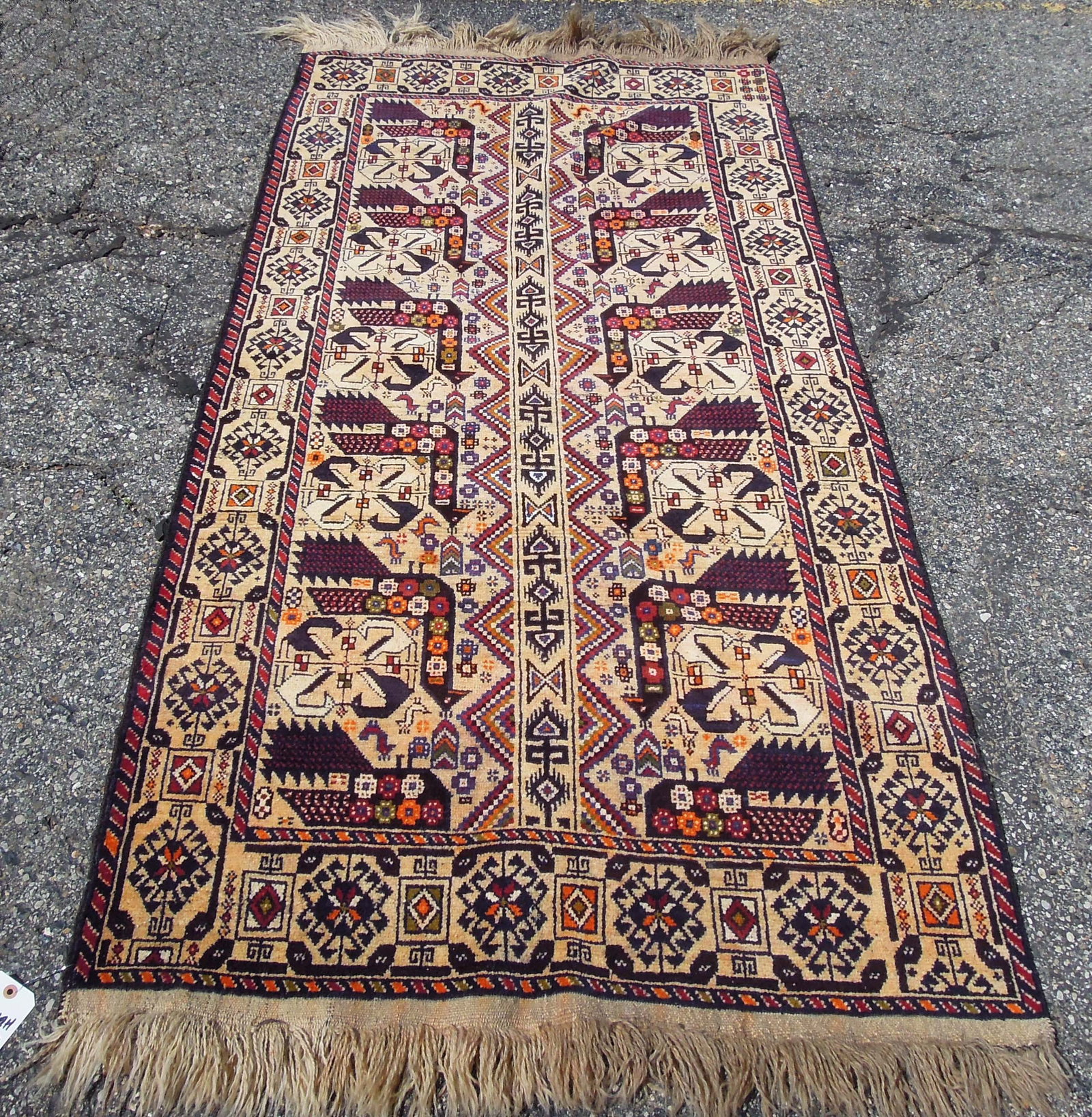 HAND KNOTTED BELOUCH AREA RUG: 3'6" x 6'9".