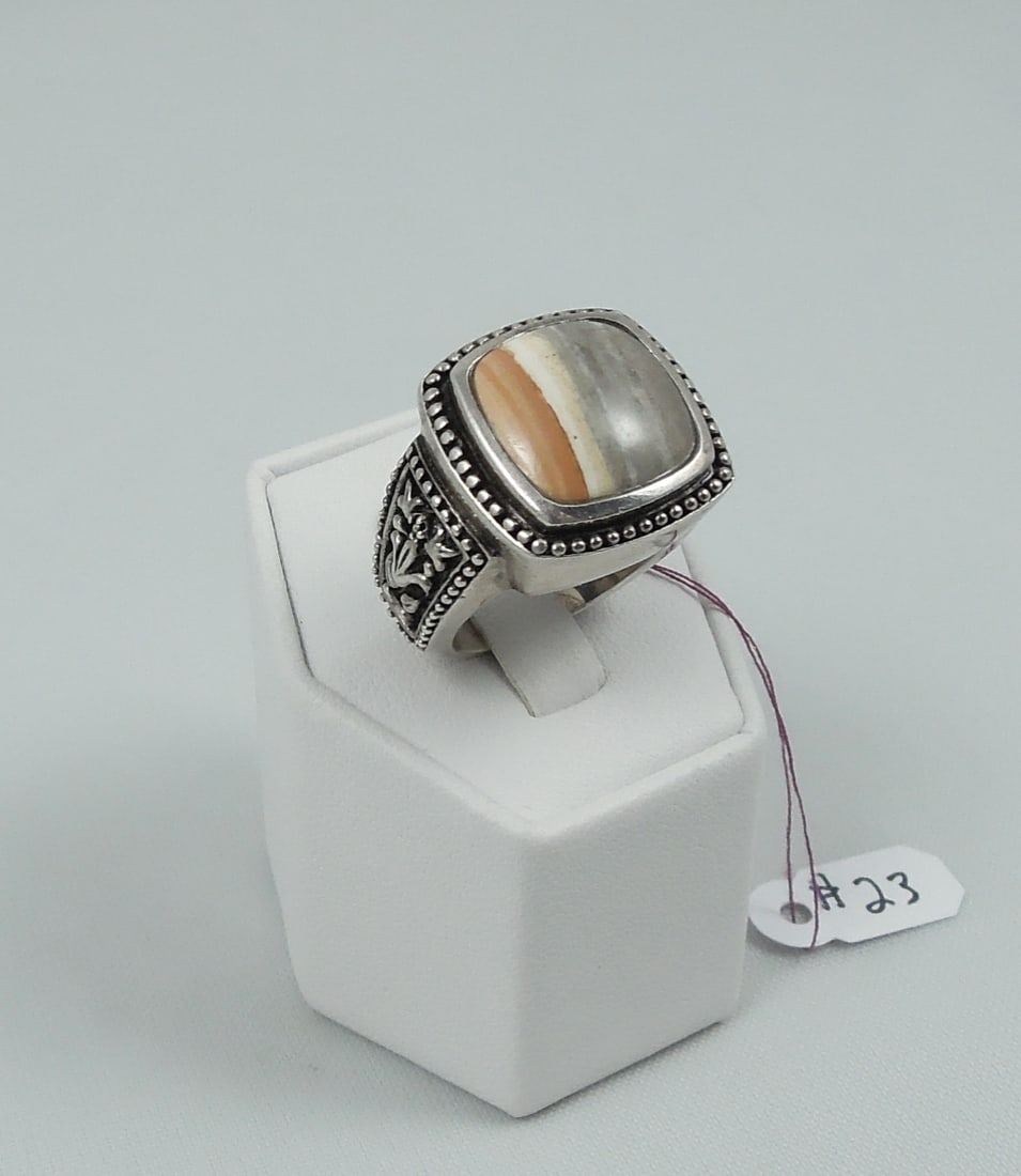 RARE STERLING SILVER & CAYMANITE RING: Signed "Caymanite, Cayman Islands 925, Circa 2007, Designs by (with signature). Ring weighs 18.8 grams. Size 8.