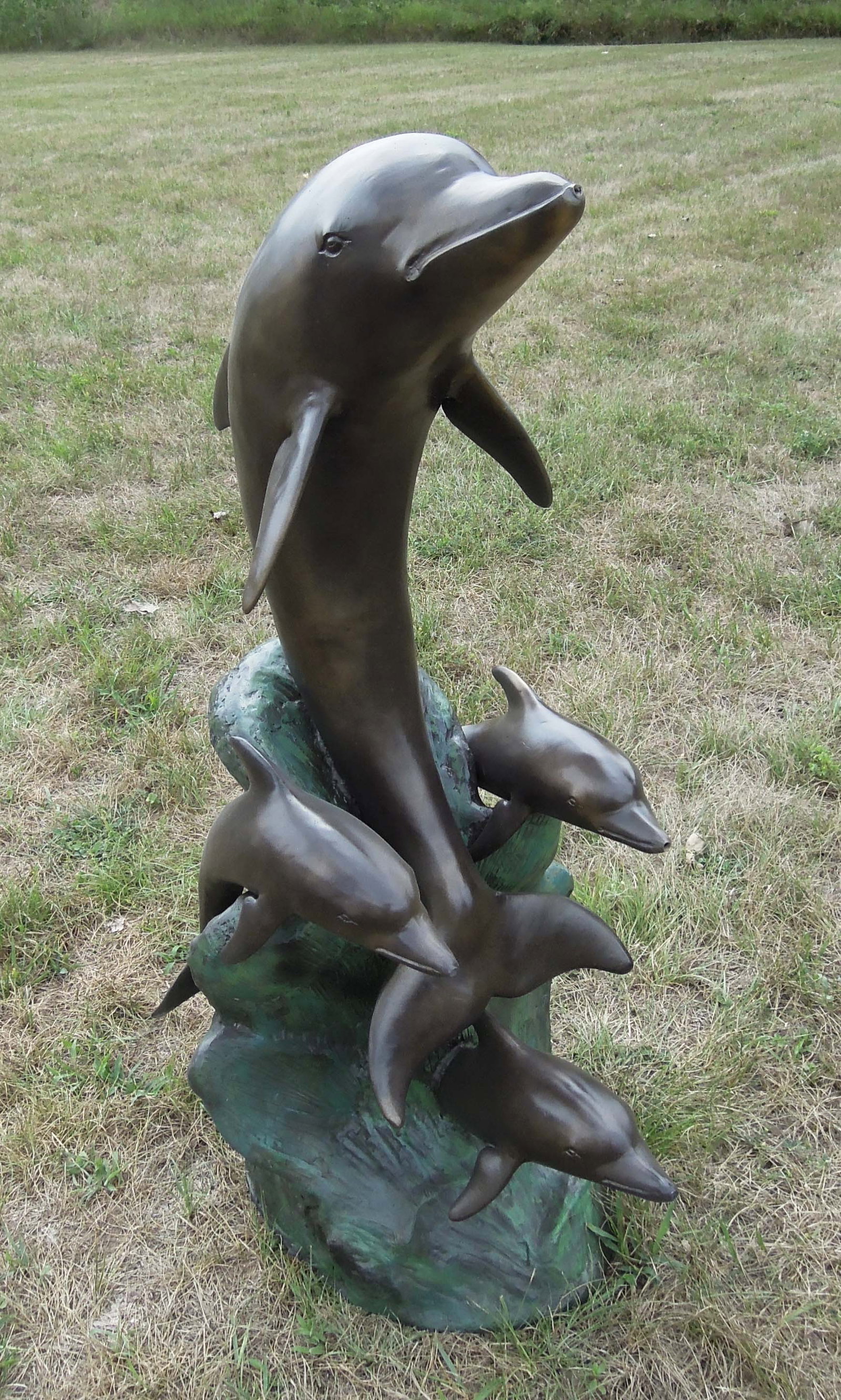 VINTAGE BRONZE SCULPTURE/FOUNTAIN OF DOLPHIN FAMILY: Four dolphin appear to be swimming in wage. Water emerges from each dolphin's mount when used as a fountain. This bronze has recently been re-patina'd. 39" high, 17" wide, 19" deep.