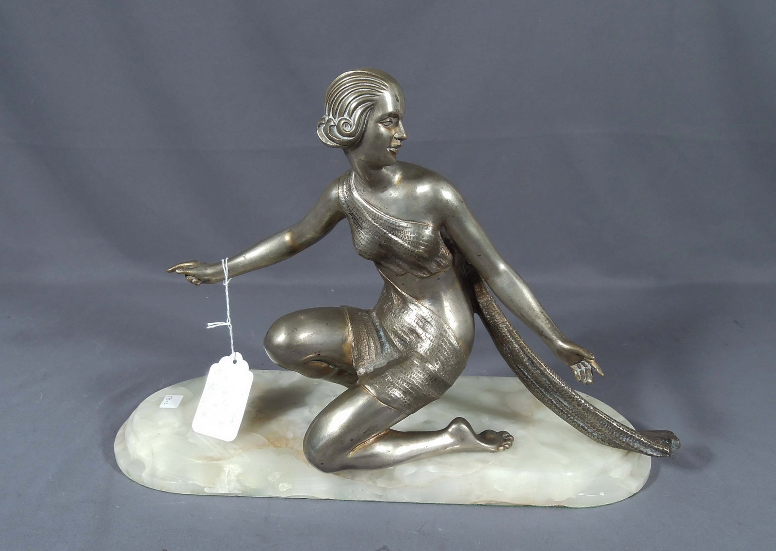 ART DECO BRONZE SCULPTURE OF DANCER: Dancer strikes a pose. Vintage onyx base. 12" high, 18" wide, 6 1/4" deep.