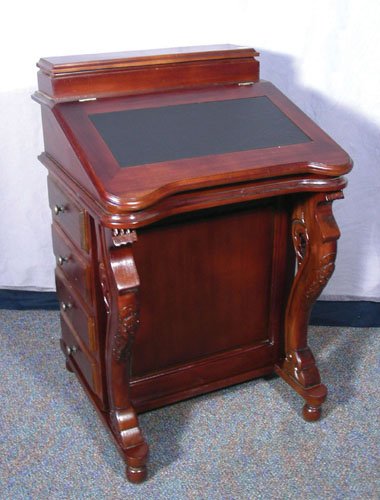 HAND CARVED MAHOGANY AND LEATHER DAVENPORT DESK: HAND CARVED MAHOGANY AND LEATHER DAVENPORT DESK Flip top. Four drawers on each side. 32 1/2" high, 21" wide, 19 1/2" deep
