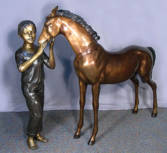 ADORABLE LIFE SIZE BRONZE SCULPTURE OF YOUNG GIRL WITH: A young girl pets pony under his chin. Very fine detail. Three color patina. 46 1/2" high, 49" wide.