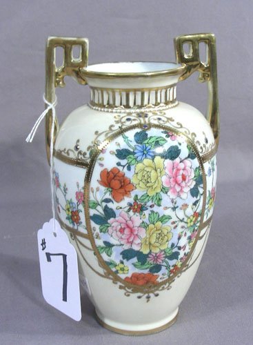 OLD HAND PAINTED NIPPON TWO HANDLED VASE: Floral motif. Signed on base. 8" high, 4 3/4" wide.