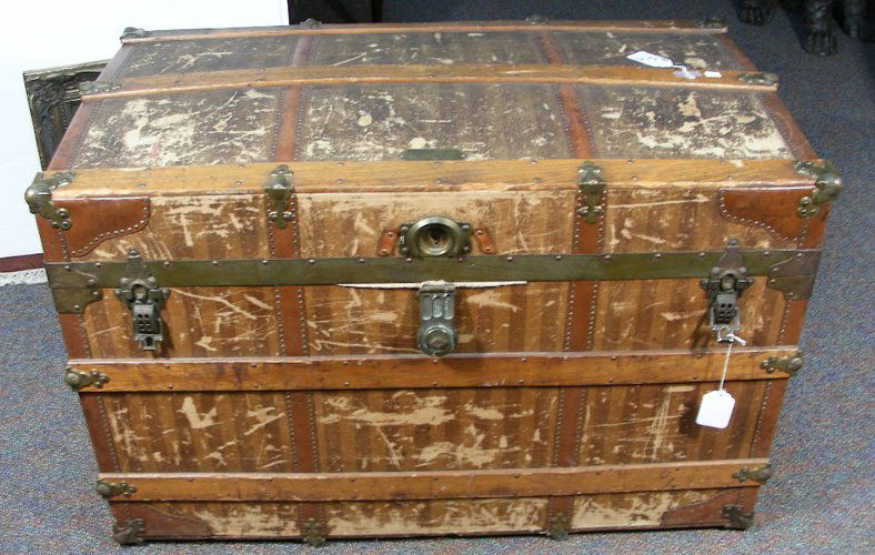LARGE ANTIQUE STEAMER TRUNK: By Haskell Bros. Manufactures, Chicago, USA. Trunk open to reveal bins for storage. 24" high, 40" wide, 22 1/2" deep.