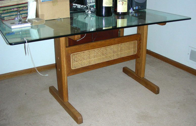 OAK TABLE WITH RECTANGULAR GLASS TOP: 30" high, 58" wide, 38" deep.