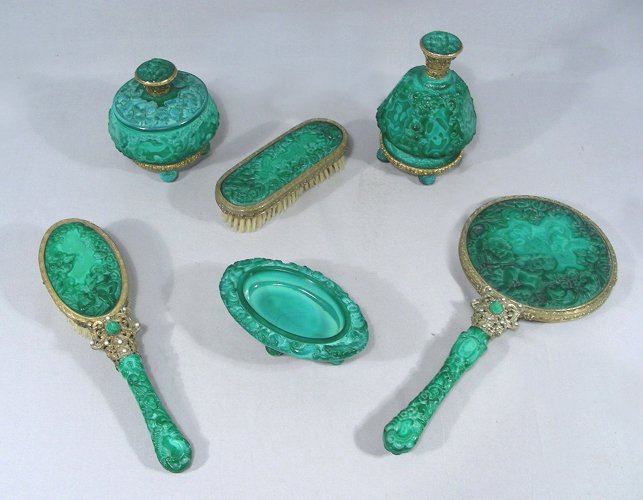 VINTAGE 1930'S CARVED MALACHITE GLASS AND BRASS SIX: Set includes: Hand mirror, perfume bottle, covered dish, 2 brushes and oval footed dish. Very ornate.