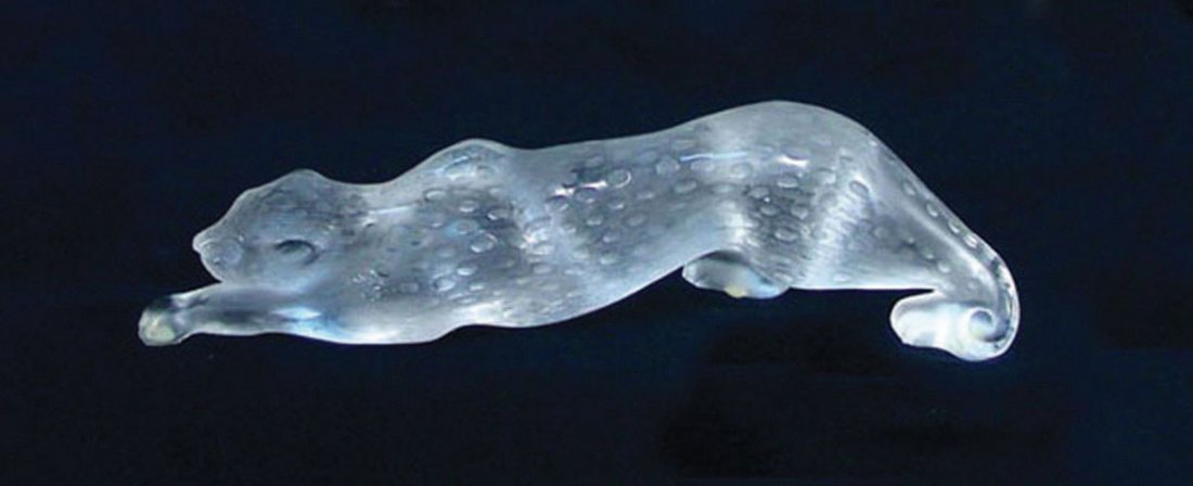 LALIQUE FRENCH CRYSTAL SCULPTURE OF PANTHER "ZEILA": Signed on base. Excellent condition. Original box included. Current retail price $2,500. 4 1/2" high, 14 1/2" long.