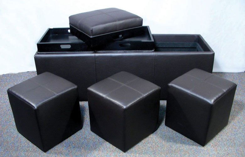 SEVEN PIECE UPHOLSTERED BENCH/STOOL SET: A rectangular brown upholstered triple seat bench with three cushions that lift off and turn to make table trays. Inside are three individual stools. Overall 19" high, 50" wide, 17" deep.