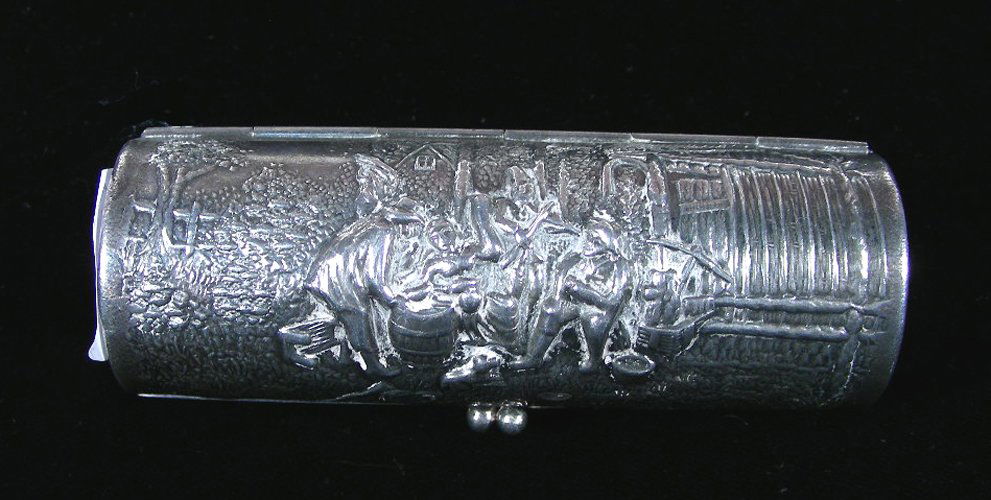 ANTIQUE SILVER PLATED LIPSTICK CASE: Ornate repousse design. Very good condition. Marked "Made in Denmark".