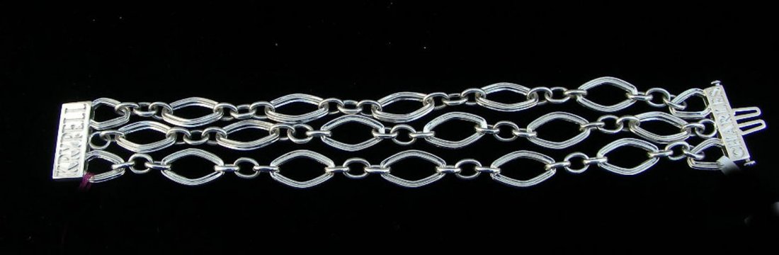 DESIGNER CHARLES KRYPELL 14K AND STERLING BRACELET: A triple link bracelet with heavy clasp. Ensriped Charles on one end and Krypell on other end.