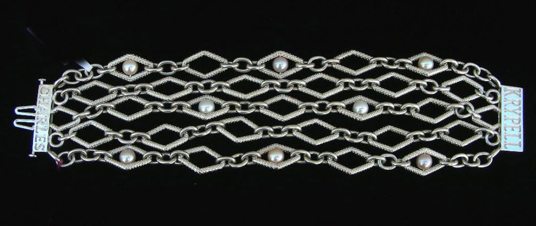 DESIGNER CHARLES KRYPELL 14K, STERLING SILVER AND PEARL: A wide five row bracelet with triangular sections set with pink and white fine cultured pearls. Heavy clasp with "Charles Krypell" inscribed on each end.