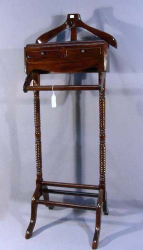 HAND CARVED MAHOGANY VALET: Complete with coat hanger, pant rack and two drawers. 4' high, 18" wide.