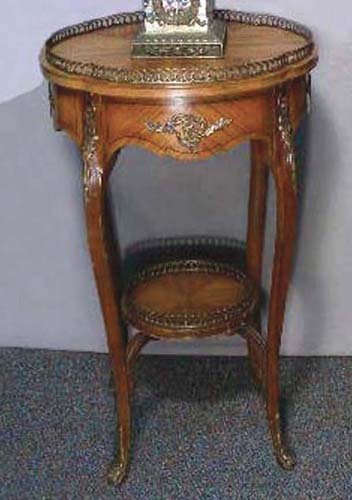 VINTAGE FRENCH HAND CARVED WOOD AND ORMOLU ROUND TABLE: Curved legs with carving in high relief. Ormolu rails. 30" high, 18" dia.