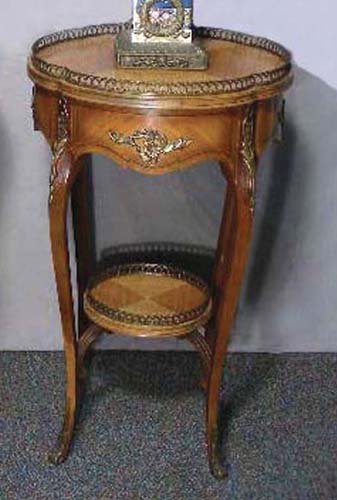 VINTAGE FRENCH HAND CARVED WOOD AND ORMOLU ROUND TABLE: Curved legs with carving in high relief. Ormolu rails. 30" high, 18" dia.