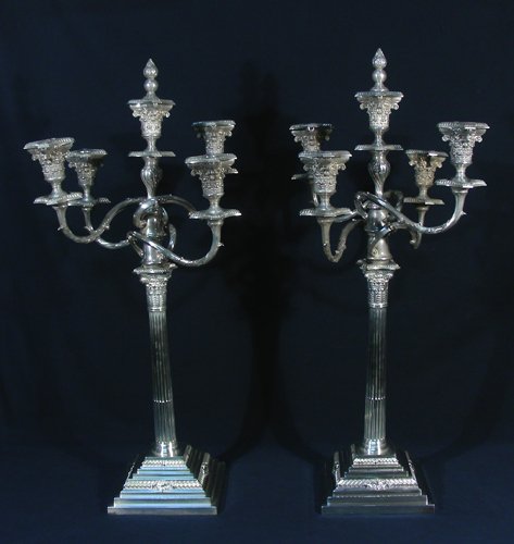 PAIR ANTIQUE SILVER PLATED FIVE LIGHT CANDELABRA: Ornate candelabra that can be used as single candle sticks, a triple candelabra or five light candelabra. 29" high, 12" wide.