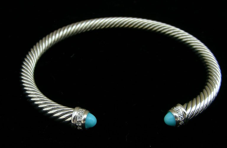 DESIGNER DAVID YURMAN STERLING SILVER CABLE BRACELET: Each end of bracelet set with turquoise with a single row of diammonds. Signed.