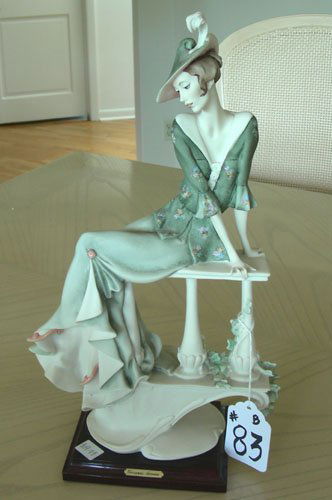 GUISEPPE ARMANI PORCELAIN SCULPTURE OF WOMAN: Lady seated on park bench "Young Lady on Balaustre". 1991 Florence. 15 1/2" high.